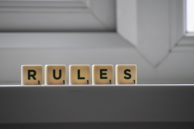 "rules" written in scrabble tiles